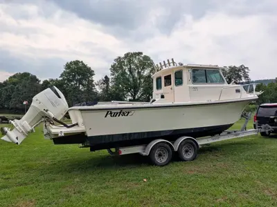 2003 Parker 2520XL with 300HP Suzuki and 2012 Aluminum Loadrite Trailer.