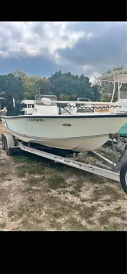 2110 action craft tournament edition with Mercury 150hp 2 stroke and magic tilt 2 axle trailer