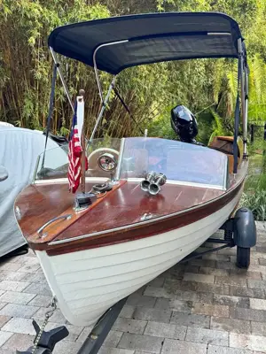 Antique Thompson boat with trailer