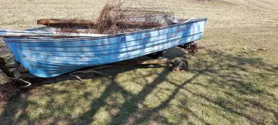 Old fiberglass boat and trailer
