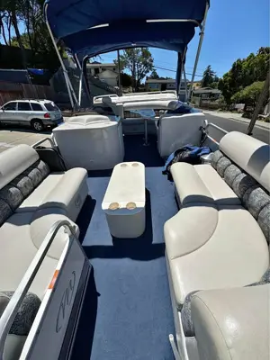 2004 Manitou Legacy 22’ pontoon/ 2 axle galvanized trailer