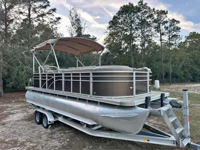 Pontoon Boat with Aluminum Trailer and 140 hp Suzuki with 300 hrs.