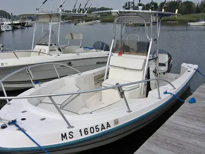 MAKO Center Console Boat with Yamaha 130 H.P. engine, and Shorelander roller trailer.