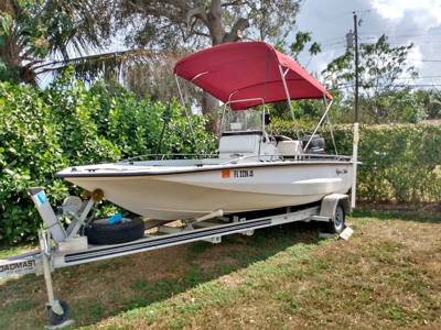 18.8 ft boat with motor and trailer